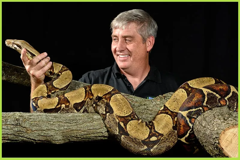 John Mack with a reptile